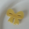 Minimalist yellow acetate bow hair clip with smooth resin finish for women - Yellow