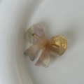 Pastel bow-shaped acetate hair clip with a colorful iridescent finish for women - AB Color