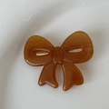 Elegant brown tortoise shell bow hair clip with a smooth acetate finish for women - Brown