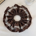 Detailed close-up of a large layered brown satin and black polka dot mesh hair scrunchie - Dark Coffee