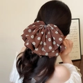 Vintage brown polka dot bow hair clip with rhinestones shown on a model's ponytail - Maillard Polka Dot Brown (FJ-0277-7)