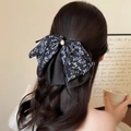 Elegant blue floral bow hair claw clip with chiffon pleats and pearl on long wavy hair - Blue Floral Print