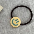 Elastic hair tie in black with a cute yellow round smiley face pendant for women - Yellow