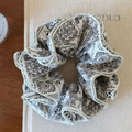 Detailed close-up of white paisley print scrunchie with intricate mandala patterns - Four-Layer Off-White Floral