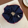 Detail of navy blue fabric scrunchie with red hearts and Hand Made label - Navy Blue Lock Edge Heart Style