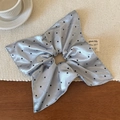Detail of light blue satin scrunchie with black polka dots and wavy pleated edges - Silver Blue Glossy Polka Dot