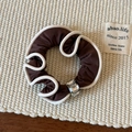 Macro detail of a brown satin scrunchie with white wavy edges and crystal accents - Crystal Hair Tie / Coffee