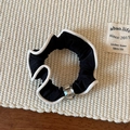 Close-up of black elastic hair scrunchie with white wavy edges and crystal bead detail - Crystal Hair Tie / Black