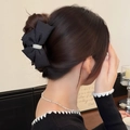 Pince à cheveux noeud noir élégante avec perle pour coiffures et chignons sophistiqués - Noir