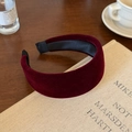 Detailed macro view of dark red velvet wide headband with premium satin inner lining - Burgundy
