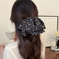 Elegant oversized black scrunchie with pink floral pattern for ponytail styling - Black and White Speckled