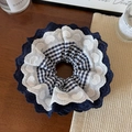 Macro shot of navy plaid fabric hair tie with delicate layered lace and heart embroidery - Navy Lace Border Scrunchie
