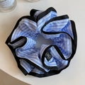 Detailed macro view of a blue and white striped scrunchie with elegant black satin trim edge - Blue Stripe