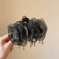 Detailansicht der schwarzen Netz-Haarklammer mit Glitzer und Kristallanhängern - Netzklammer 11cm