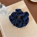 Detailed close-up of blue polka dot scrunchie with elegant white pearl pendant detail - Navy Blue Pearl Hair Ring