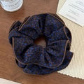 Coletero floral marrón con estampado de leopardo y acabado de borde delicado - Lunares azules