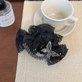 Detailed shot of large black lace bow hair claw with sequins and sparkling rhinestone butterfly - Black (11cm)