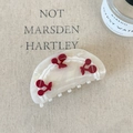 Detail shot of pearl white acetate hair claw clip with red cherry rhinestone motifs - Mermaid Color