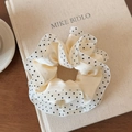 Detail of elegant cream satin scrunchie with black polka dots and mesh lace trim decor - Double Layer White Polka Dot