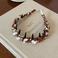 Detail of fabric wrapped headband with amber beads and non-slip inner teeth design - Brown