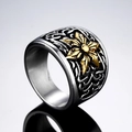 Vintage steel ring with black engraved patterns and golden starburst center detail - US 7 / Gold & Silver