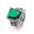 Macro shot of vintage titanium ring featuring a large emerald green stone and Viking engraving - Size 7 / Silver Color Green Zirconia