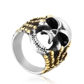 Macro view showing two-tone skull ring detail with silver skull and golden side claws - US 7 / Gold & Silver