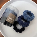 Detail of high-elasticity plaid hair ties with honeycomb texture in a storage jar - Blue Series