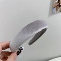 Detail of silver-grey velvet sponge headband showing thick fabric texture and shimmer - Gray