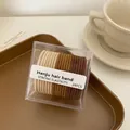 Set mit 24 erdigen Haargummis in Beige, Gelb und Dunkelbraun mit hoher Elastizität - Erdton-Kombination