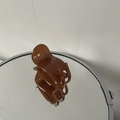 Detailed view of a brown amber textured shark clip with a glossy translucent finish - Light Coffee