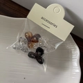 Close-up of 4pcs mini jelly color bow hair clips in transparent plastic packaging - Dark Gray Mini Bow