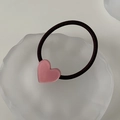 Close-up of pink acetate heart charm on a black high-elastic hair tie for daily wear - Pink