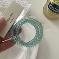 Close-up of light cyan spiral hair ties in a two-piece set with accessories packaging - Spiral Hair Ties Set / Cyan