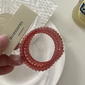 Three spiral phone cord hair ties in deep pink, packed on a white accessories card - Spiral Hair Ties Set / Red