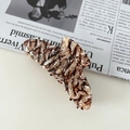 Detail of a handmade butterfly tortoise shell acetate hair claw with marble texture - Marble Brown