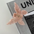 Detail of butterfly hair claw clip with pink marble acetic texture and gold spring - Orange Pink
