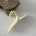 Detail view of large 13cm matte cream hair claw clip with internal metal spring mechanism - Off White