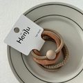 Close-up of assorted earth-tone elastic hair bands with bead detail on a display card - Round Bead Light Coffee