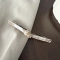 Detail of elegant acetate hair clip with marble pattern and metal spring clip back - Transparent Apricot
