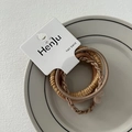 Detailansicht von drei strukturierten elastischen Haarbändern in eleganten Kaffeetönen - Schleife Hellkaffee