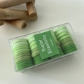 Detailopname van elastische haarelastiekjes met groen verloop in een transparante doos - Groen
