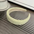 Detail of light green thick tweed headband on a gray tray with a ceramic cup - Padded Headband / Yellow