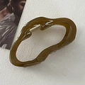 Olive green irregular hair claw clip with glossy finish and minimalist hollow loop design - Irregular Green