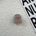 Macro view of handmade acetate mini hair claw clips in colorful marbled pastel tones - Blue & Pink