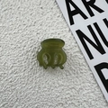 Detailed macro view of olive green acetate hair claw with France Handmade inscription - Green