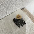 Close-up of 5-piece black teardrop BB clips in handmade style packaging on woven mat - Black