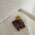 Close-up of 5-piece brown matte BB clips on a handmade card with ins-style background - Burgundy