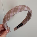Detail of vintage plaid headband featuring handmade label and brown purple woven fabric - Purple Camel Plaid