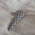 Detailed view of blue and brown gingham fabric hair clip on soft linen background - Triangle Snap Clip - Blue Coffee Plaid